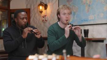 Two people playing flutes