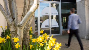 Attendee walking through the door of IAB UK Leadership Summit