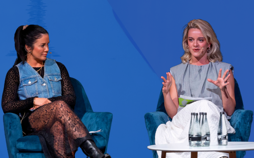 two speakers at the retail media upfronts presenting 